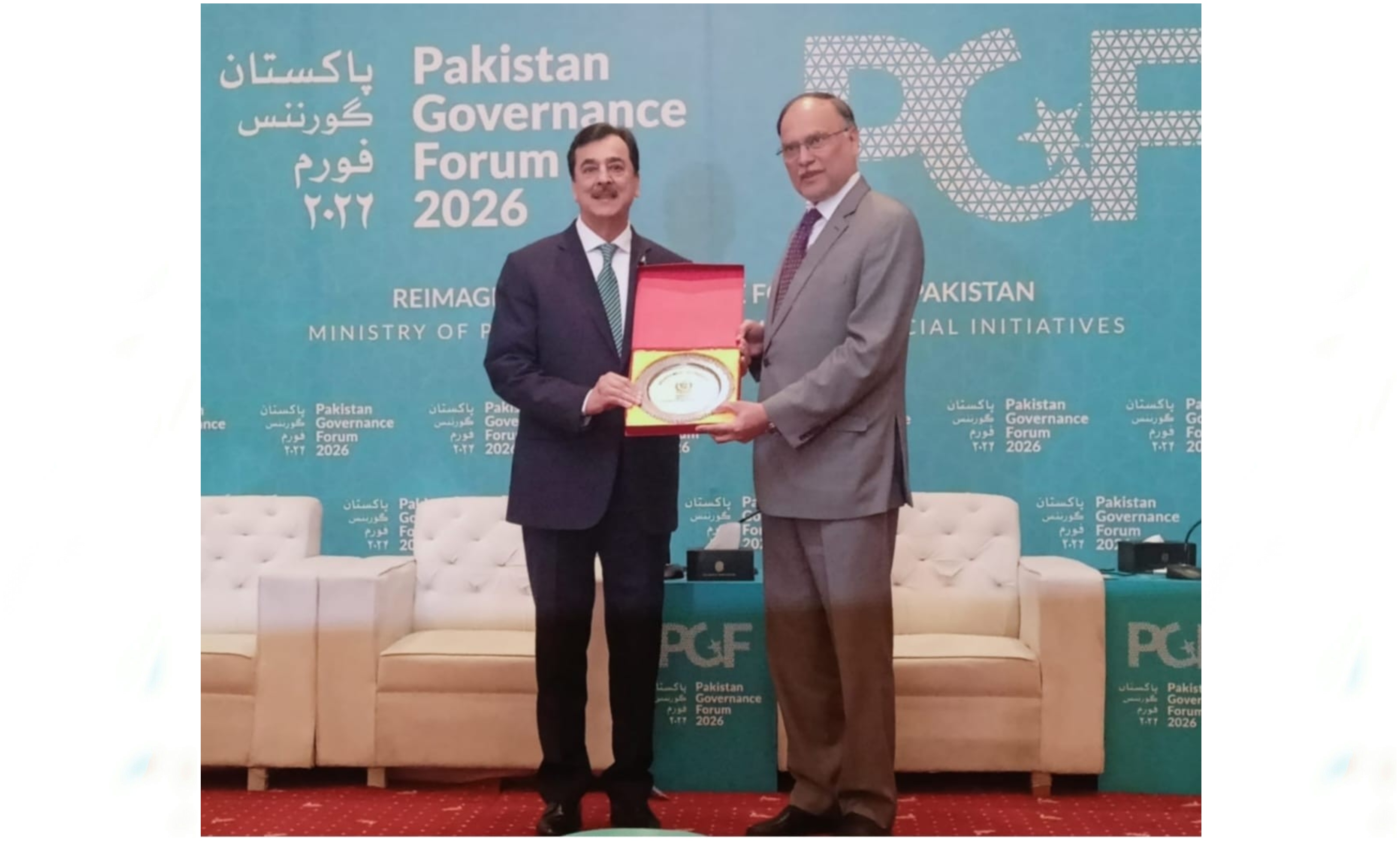 A Souvenir Being Presented to Chairman Senate, Syed Yousaf Raza Gilani by Ahsan Iqbal Chaudhary, Minister for Planning Development & Special Initiatives at Closing Ceremony of The Pakistan Governance Forum 2026 in Islamabad 